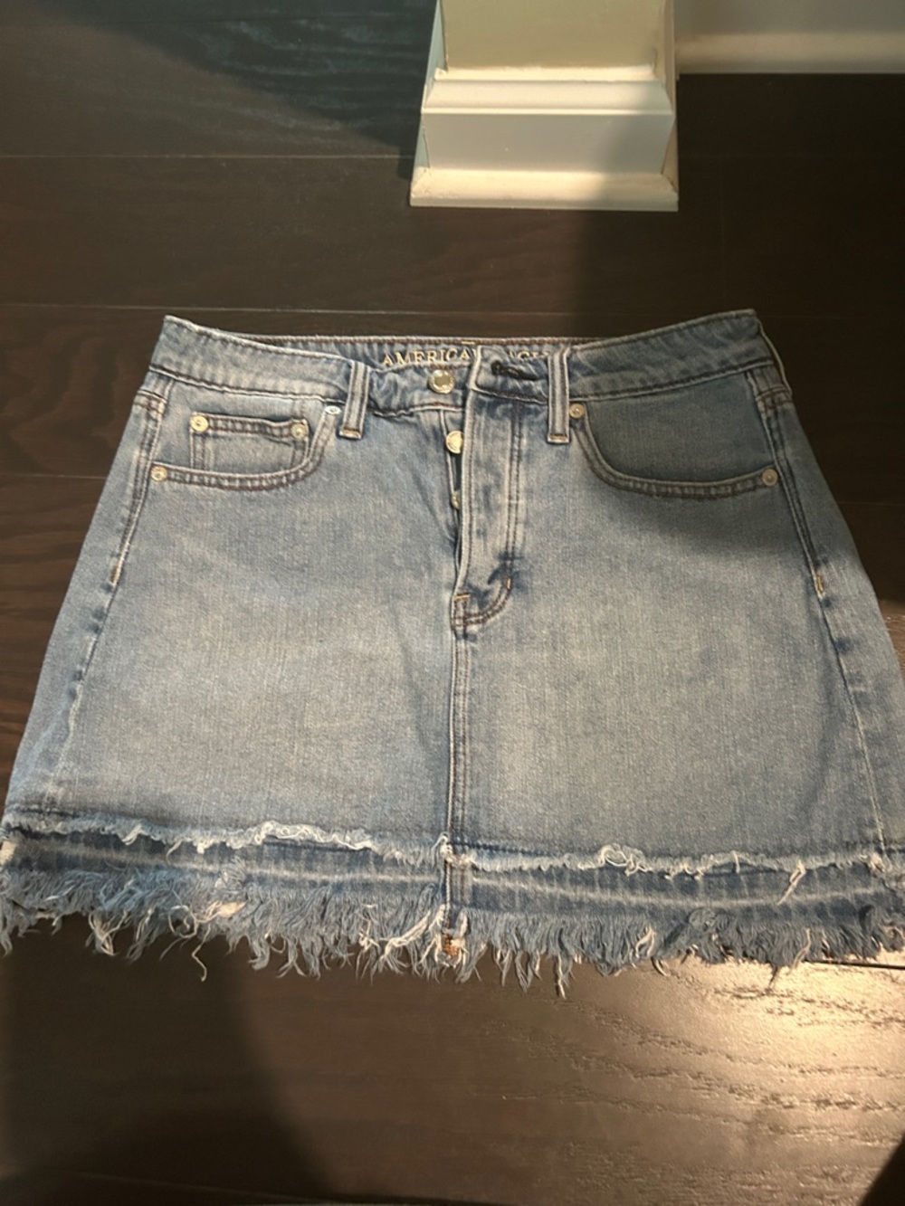 American Eagle Outfitters Light Blue Denim Mini Skirt with Distressed Hem